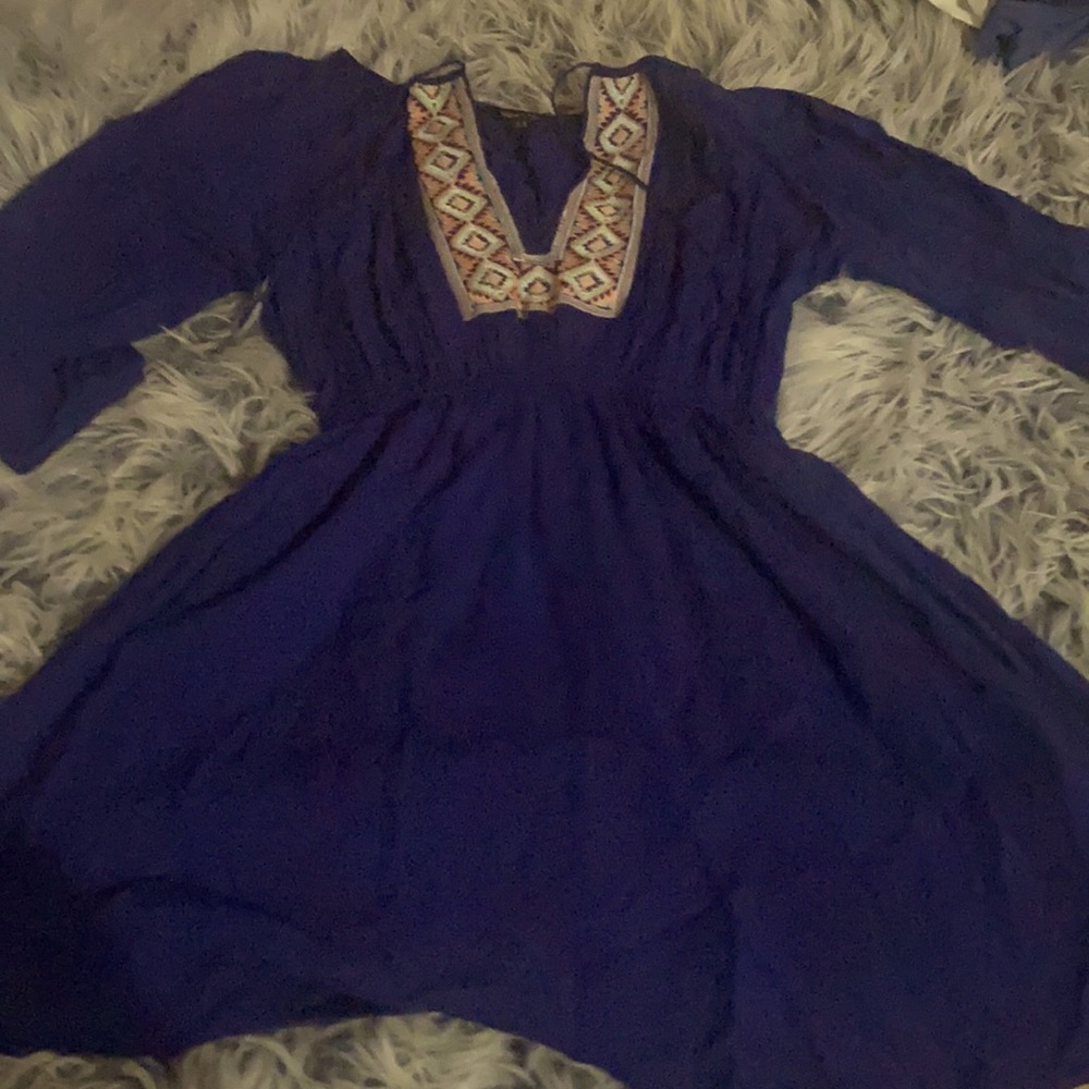 - A deep blue dress with an mandala based de…